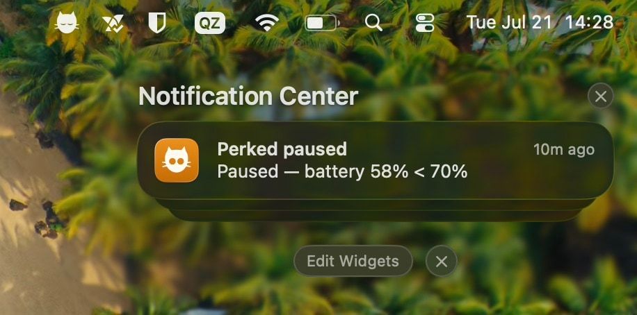 A macOS notification reading “Perked paused — battery 58% < 70%”.